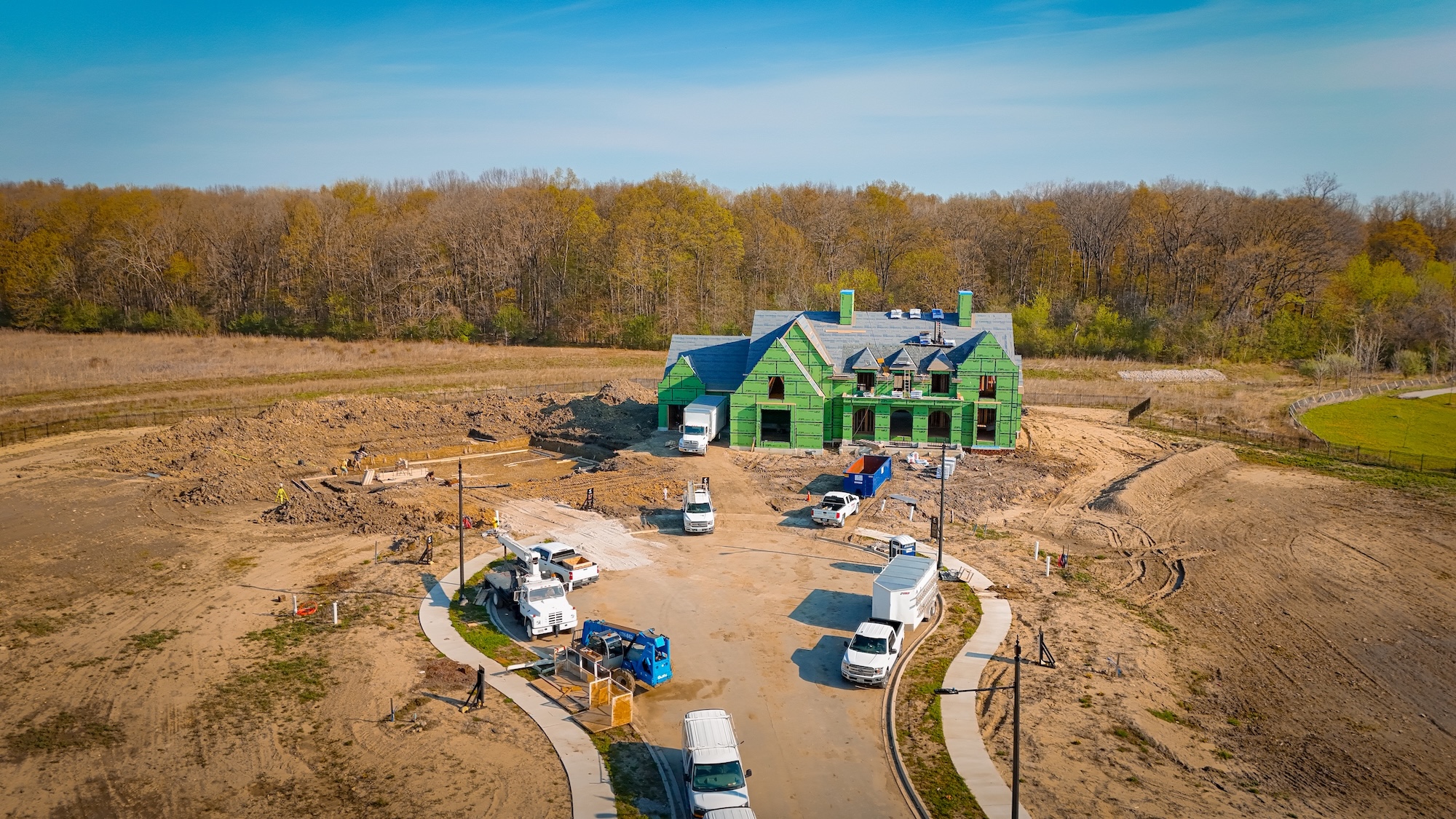 Cedarview Estates construction progress with the first homesite framed and roofing underway